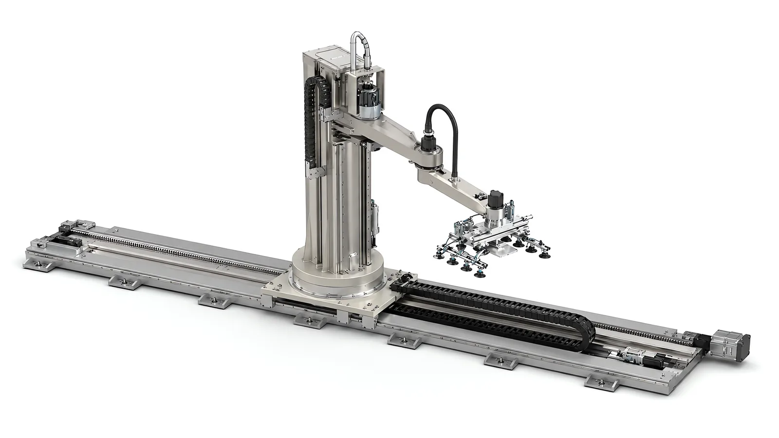 A column-mounted robot on an ultra low profile linear track: the rail assembly sits flat against the floor on bolted plates, with a toothed rack along one edge, a flat energy chain in a shallow central trough and end stops at both ends of the stroke