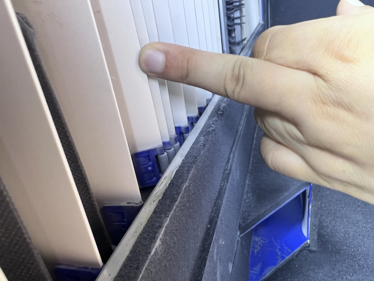 Physical installation of CNC shot peening machine for turbine blade processing at aerospace MRO facility